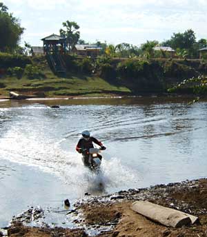 dna dirt bike rider in the river