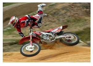 having a dirt bike crash on a track