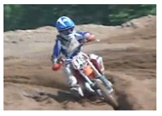 taking a corner on a mini dirt bike